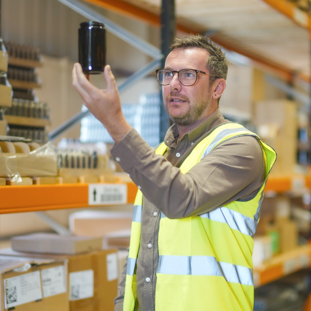 Coloured Bottles warehouse team checking glass jars